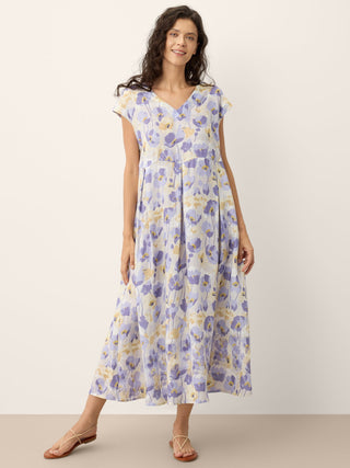 LINTICO Harriet linen maxi dress with carnation print, scalloped waist, sleeveless design, ideal for summer garden wear.