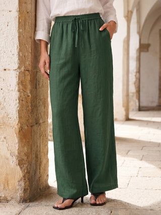 LINTICO 100% linen classic pants LYON in evergreen color, tailored fit with side pockets and belt loops, front view.