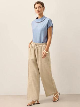 LINTICO 100% linen classic khaki pants with a relaxed fit, front pockets, and tapered legs, styled as casual bottoms for women.