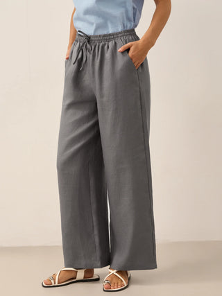 Neutral grey linen pants with a relaxed fit, featuring a classic design from LINTICO's 100% linen Lyon collection.