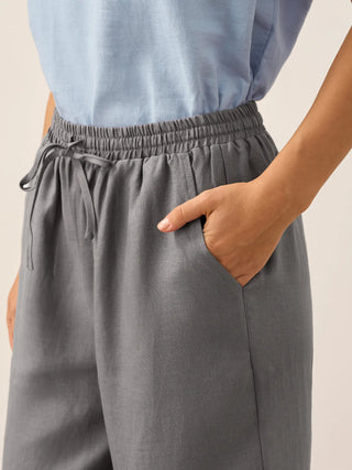 Neutral grey linen classic pants from LINTICO, featuring a relaxed fit and tailored design for stylish, comfortable bottoms.