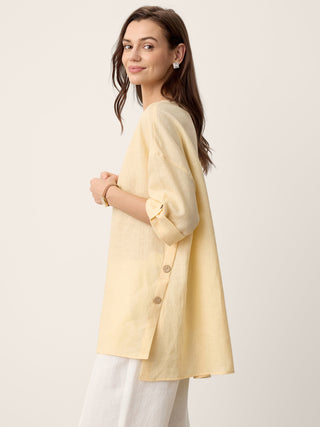 LINTICO 100% linen oversized top with curved hem in soft butter color, featuring a relaxed fit and stylish design.