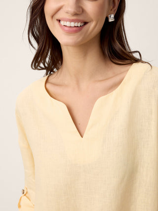 LINTICO Daphnea 100% linen oversized curved-hem top in soft butter color, relaxed fit and lightweight fabric.