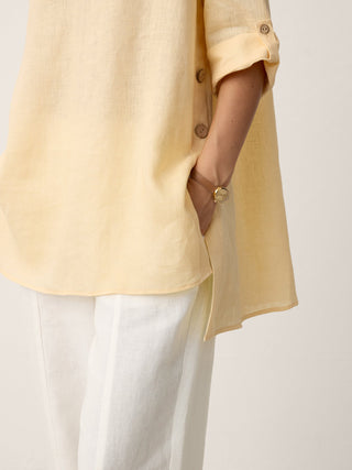 LINTICO 100% linen oversized top with a curved hem in soft butter color, designed for a relaxed, stylish look.