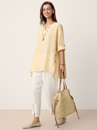 LINTICO 100% linen oversized top with curved hem in soft butter color, featuring a relaxed fit and stylish design.
