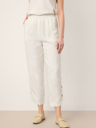 LINTICO Lindsey 100% linen double pleat pull-on pants in optic white, featuring button hem and relaxed fit.