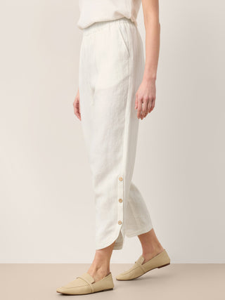 LINTICO Lindsey linen pull-on pants in optic white with double pleats and button hem, stylish and comfortable bottoms for warm weather.