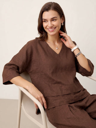 LINTICO 100% linen drop shoulder layered hem overtop in espresso brown, showcasing asymmetric design and relaxed fit.