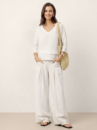 LINTICO 100% linen drop shoulder top with asymmetric layered hem in optic white, stylish and breathable for casual wear.