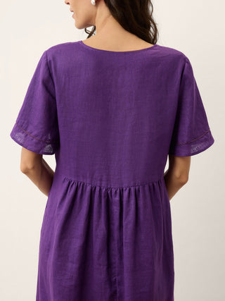 Dark purple linen maxi dress with embroidered cuffs and split neckline by LINTICO, featuring a flowy, elegant midi dress design.