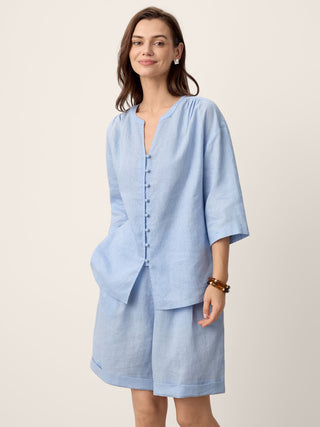 Light Azure linen split-neck shirt from LINTICO's GISELA set with frog buttons, featuring a relaxed fit and casual style.