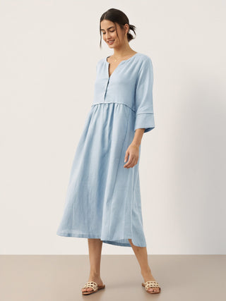 Baby blue linen maxi dress by LINTICO featuring a loose fit, button waist, and gathered design for a relaxed, elegant look.