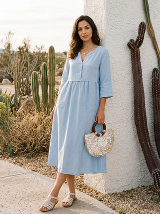 Baby blue linen maxi dress by LINTICO with loose fit, button waist, and gathered design, perfect for casual summer wear.
