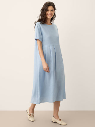 LINTICO Morgan baby blue linen short-sleeved midi dress with pinstripe paneled design and relaxed fit.