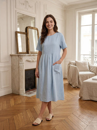 LINTICO Morgan linen short-sleeved midi dress with blue pinstripe panels, lightweight and stylish for warm weather.