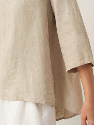 Khaki linen top with round neck and asymmetrical hem by LINTICO, styled as a casual blouse or summer top.