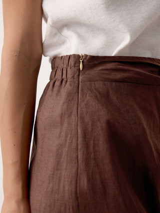 LINTICO linen twist-waist slit skirt in espresso brown, featuring a relaxed fit and elegant design, perfect for casual or chic outfits.