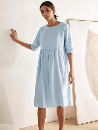LINTICO 100% linen A-line midi dress in a flowing design, perfect for casual or summer wear, shown in natural fabric detail.