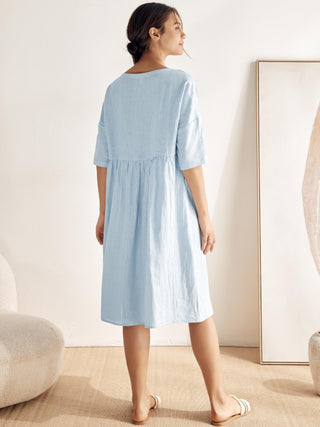 LINTICO 100% linen A-line midi dress in soft beige with sleeveless design and subtle side slit, perfect for warm-weather wear.