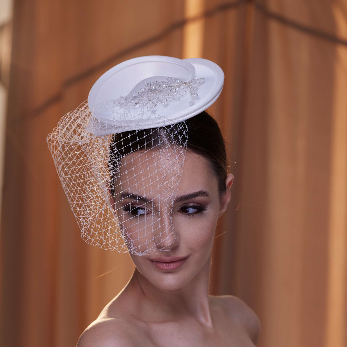 Elegant Bridal Fascinator with Beaded Details and Birdcage Veil - Glamourous Grace