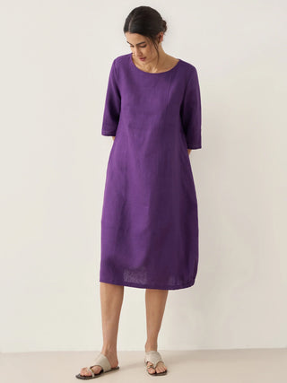 LINTICO collarless 100% linen mid-length dress with a relaxed fit, featuring a simple, elegant design perfect for warm weather.