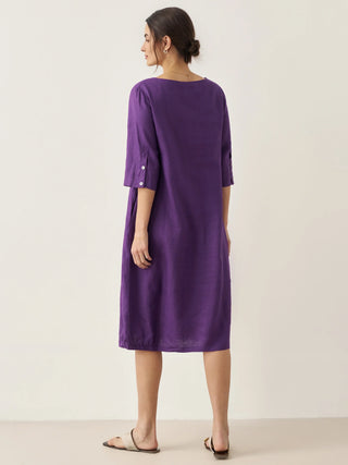 LINTICO collarless 100% linen mid-length dress with a relaxed fit, showcasing its elegant, natural fabric and simple design.