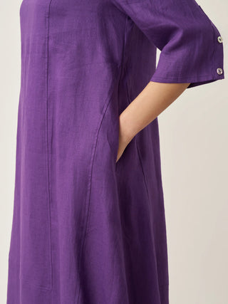 LINTICO collarless 100% linen mid-length dress with a relaxed fit, featuring a simple, elegant design and natural fabric texture.