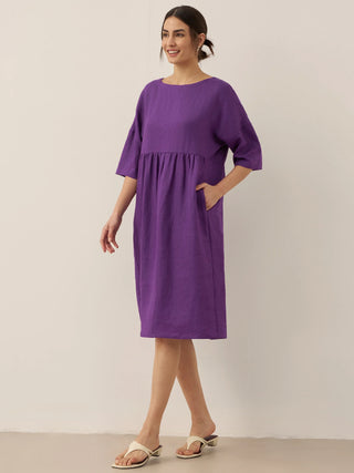 LINTICO 100% linen A-line midi dress in Valencia color, flowing design with a sleeveless silhouette and classic midi length.