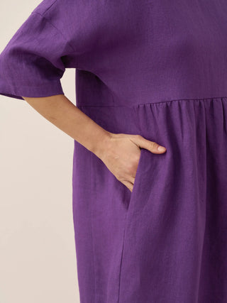 LINTICO 100% linen A-line midi dress in Valencia color, lightweight and breathable, styled on a model with a relaxed fit.