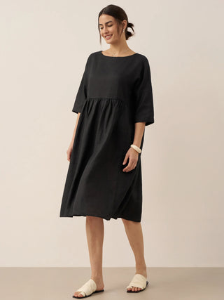 LINTICO 100% linen A-line midi dress labeled Valencia, featuring a flowy silhouette and natural linen fabric.