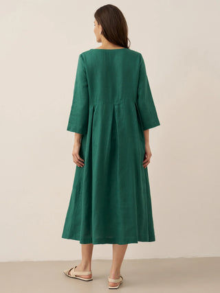 LINTICO 100% linen Bateau neck pleated maxi dress in natural linen fabric, featuring elegant pleats and a flowing silhouette.