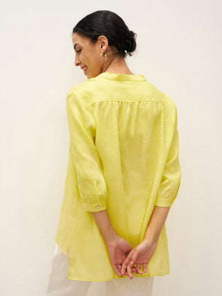 LINTICO Joanna 100% linen dress shirt, light-colored blouse with button-up front and classic collar, styled on a hanger.