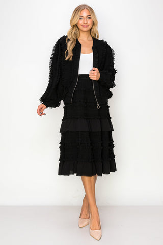 Black Willa lace ruffled skirt by Joh Apparel, showcasing its delicate lace details and flowing ruffle design.
