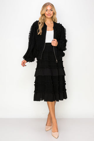 Black Willa Lace Ruffled Skirt by Joh Apparel, featuring delicate lace and feminine ruffles, styled as a stylish bottoms option.