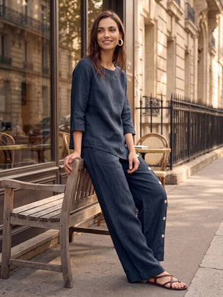 LINTICO 100% linen asymmetrical-hem button-trim top featuring a relaxed fit and natural linen fabric, displayed on a hanger.
