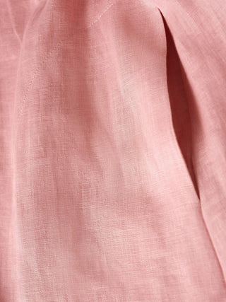 LINTICO 100% linen loose-fit maxi dress with button waist and gathered detail, shown in a natural, flowing style.