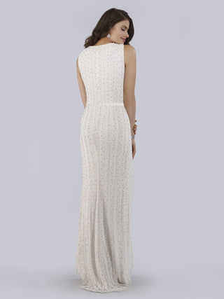 Lara New York beaded faux-wrap V-neck bridal gown with intricate bead detail and flowing fabric, elegant wedding dress.
