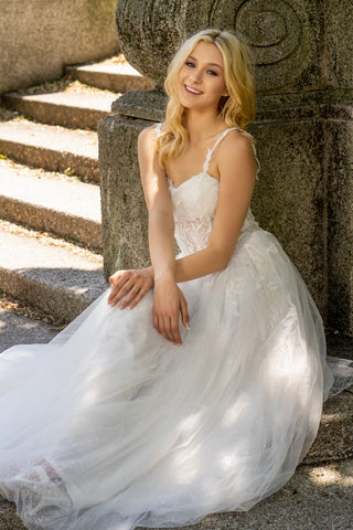 Lara New York Lara 51042 white sheer lace bridal ballgown dress with a fitted bodice and flowing skirt, elegant wedding gown.