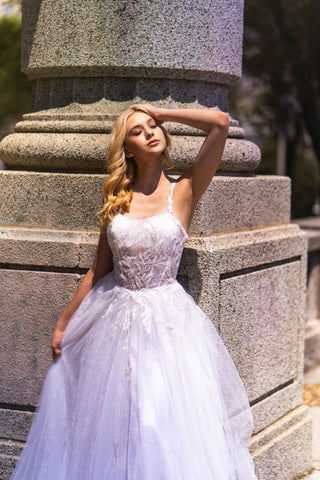Lara New York bridal ballgown with sheer lace bodice and full skirt in white, elegant wedding dress for special occasions.