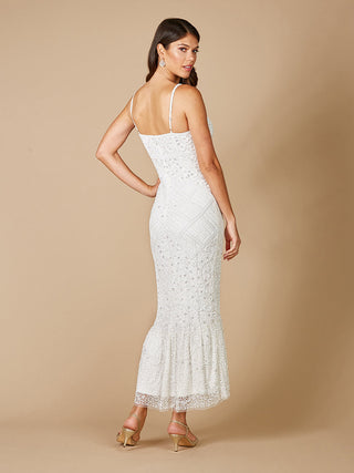 Lara Fae V-neck spaghetti strap wedding gown by Lara New York, elegant white dress with delicate straps and flowing fabric.