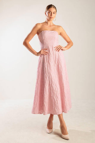 Light pink woven midi dress by Flying Tomato, showcasing its elegant fit and textured fabric design.
