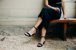 Black suede heels by J.Adams featuring a sleek pointed toe and elegant stiletto heel, perfect for stylish occasions.