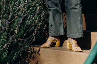 Yellow suede heels by J.Adams featuring a sleek design and pointed toe, displayed on a neutral background.