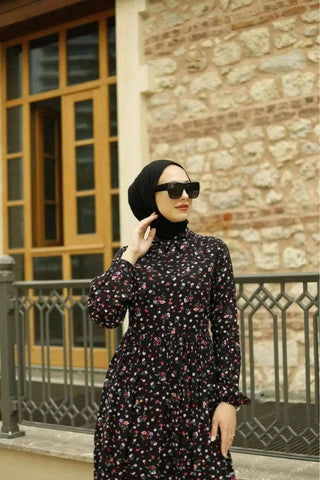 Katia maxi dress by ByBaano featuring a Peter Pan collar, flowing fabric, and elegant design, perfect for casual or formal wear.