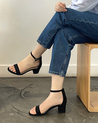 Black suede Daisy heels by J.Adams featuring a sleek design and pointed toe, displayed on a neutral background.
