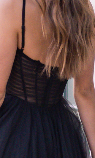 Black Yasmin gown by Lady Black Tie featuring a tulle A-line silhouette and a pleated bodice for elegant evening wear.