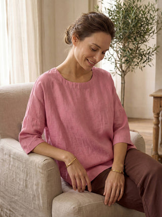 Pink linen boatneck blouse with 3/4 length sleeves by LINTICO, styled as a casual women's top.