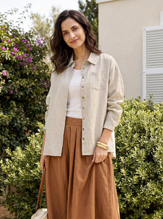 Willow cream linen shirt by LINTICO with concealed placket and patch pocket, showcasing lightweight, breathable fabric.