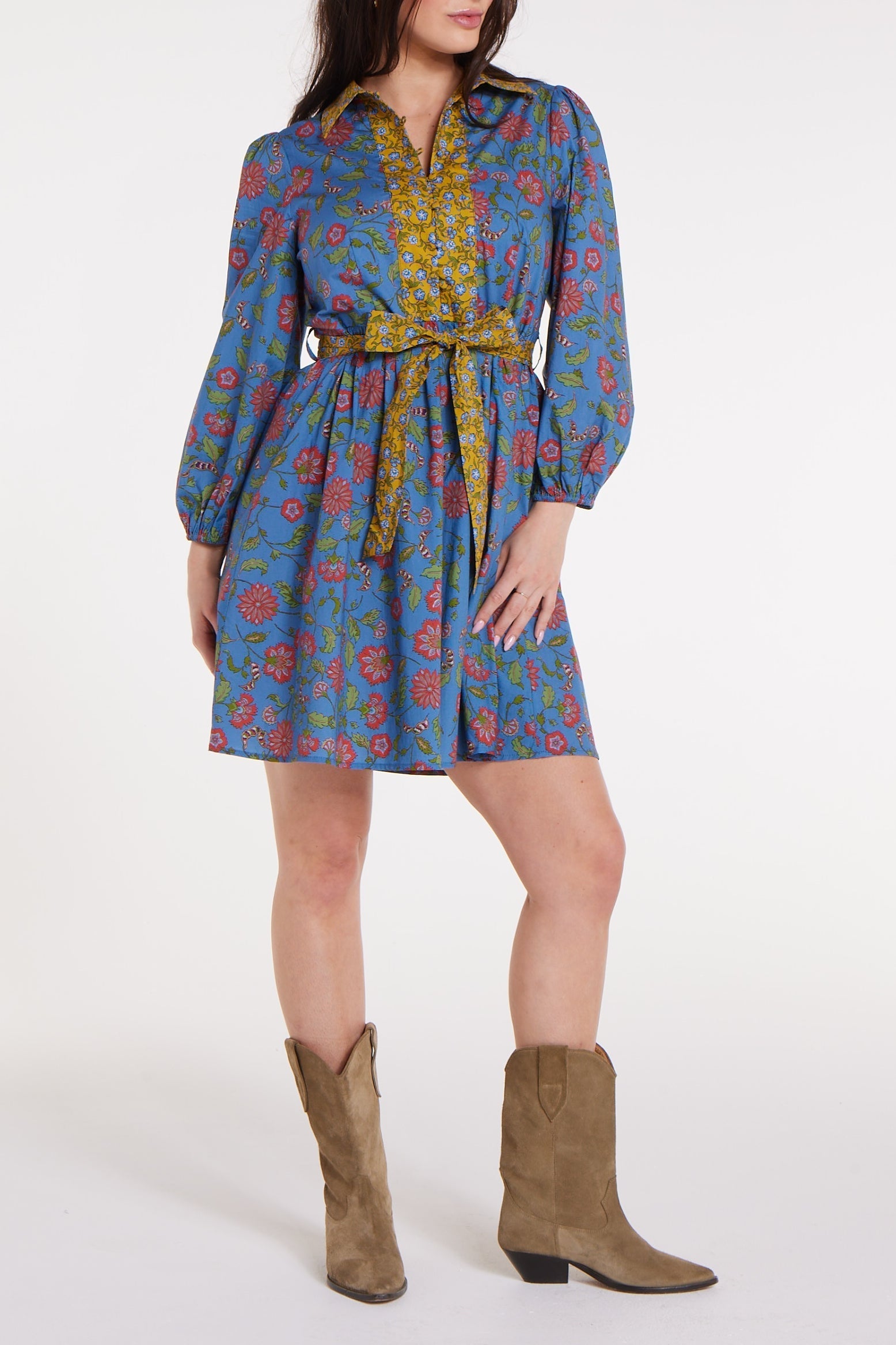 Halle Collared Belted Mini Dress in Blue Floral with long sleeves and yellow floral trim, styled outdoors with sandals.