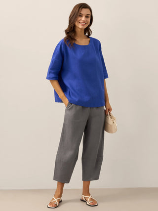 LINTICO 100% linen crop pants in neutral grey, classic ankle-length bottoms with a relaxed fit and natural fabric texture.